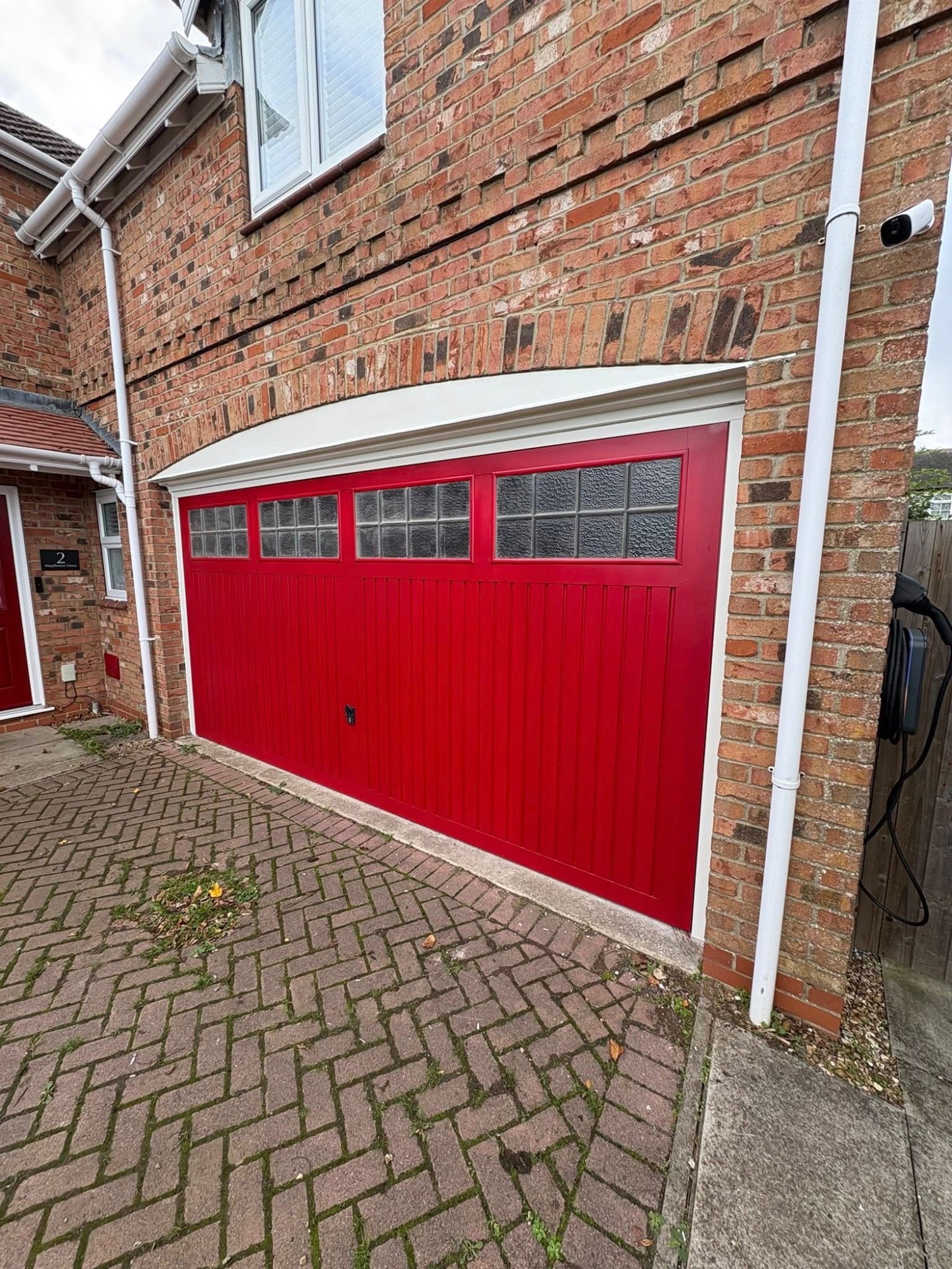 Red garage door transformation spray painting