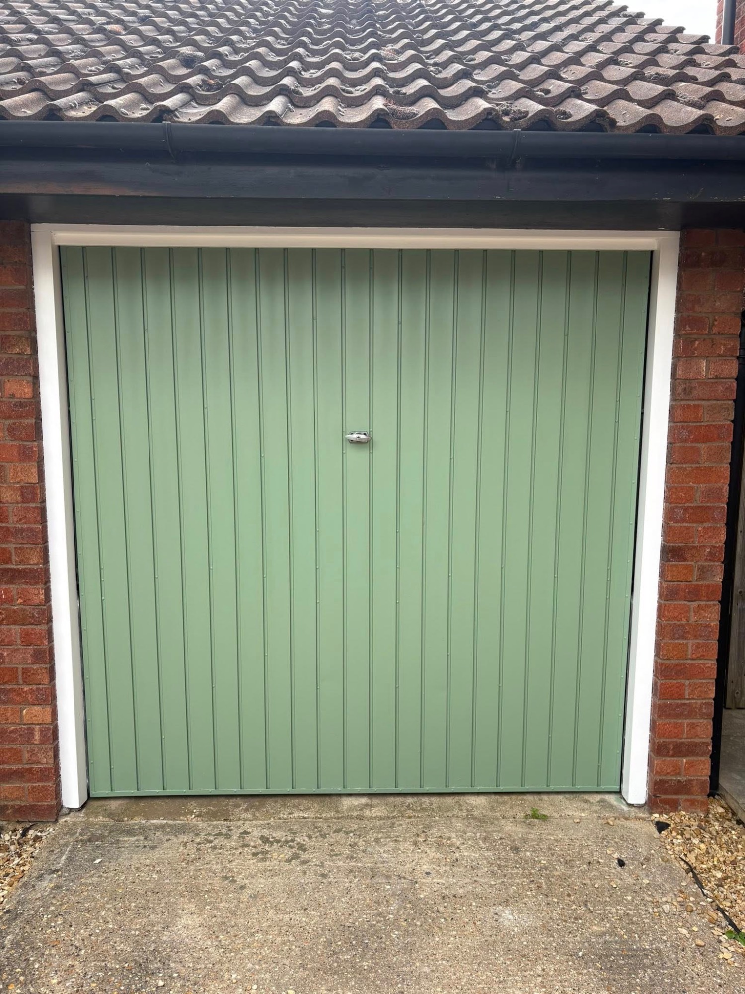 Green garage door spray painting